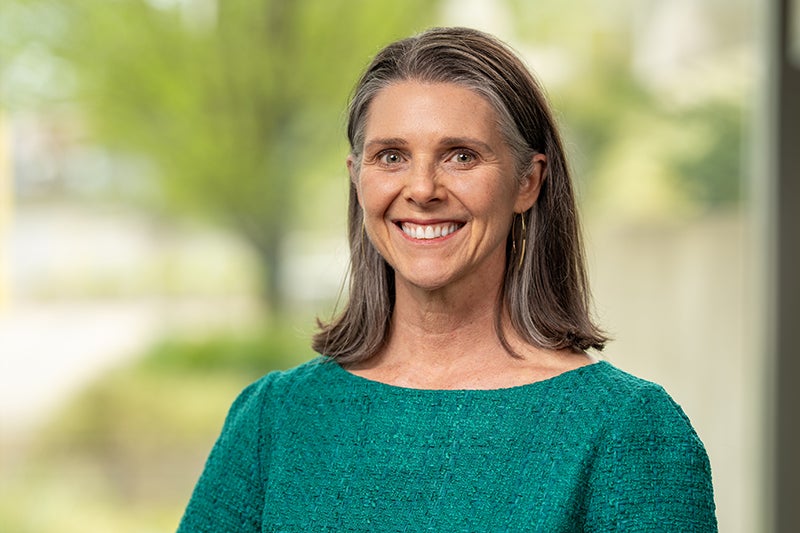 Profile photo of Margaret Trout wearing a green sweater