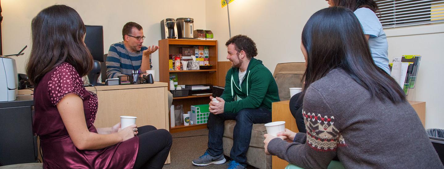 Students meeting with advisor.