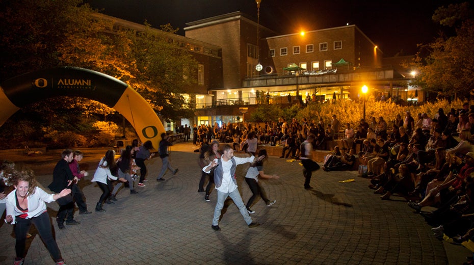 Students performing in the EMU amphitheater at night